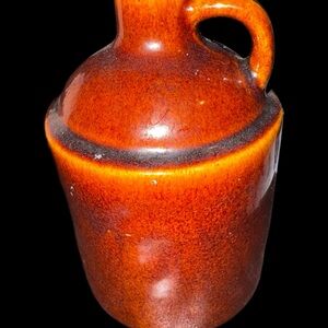 Glossy Brown Ceramic Vessel with Elegant Design